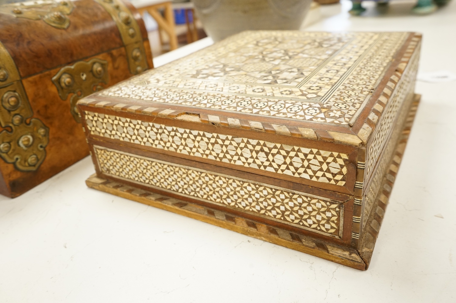 A brass mounted walnut dome topped box and another bone and mother of pearl inlaid box, 32 x 25cm